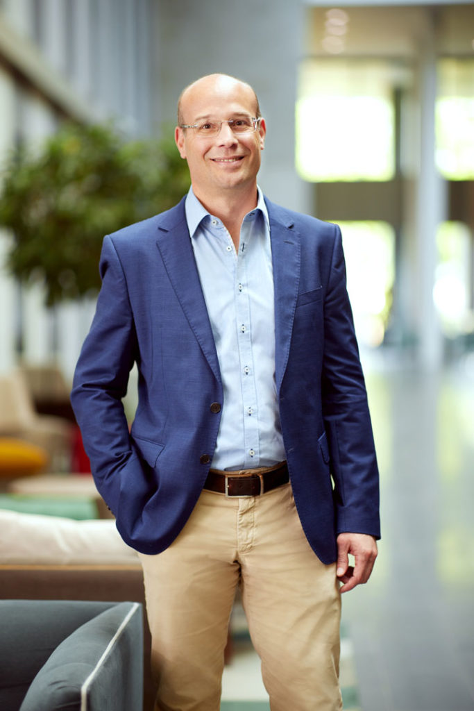 Frédéric Fiévez, Chief Operating Officer of BCE. Standing in the Atrium at BCE headquarters.